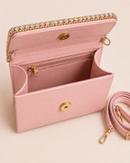 Interior view of blush pink mini bag showing satin lining, zip pocket, magnetic snap closure, and detachable shoulder strap, The House of Shine Bijou Edit
