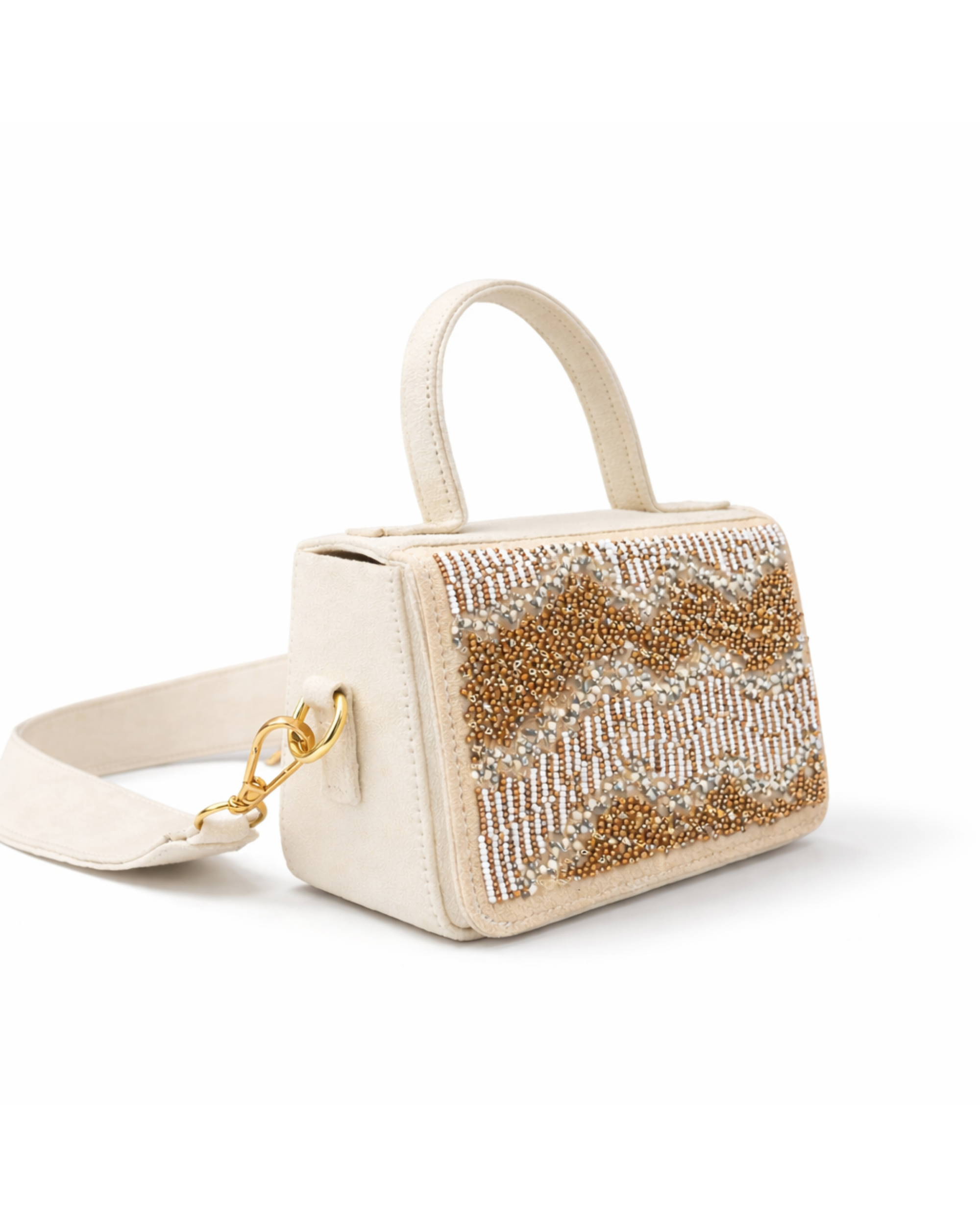 Boho hand-embroidered ivory satchel by House of Shine side angle with detachable suede strap and gold hardware on marble.