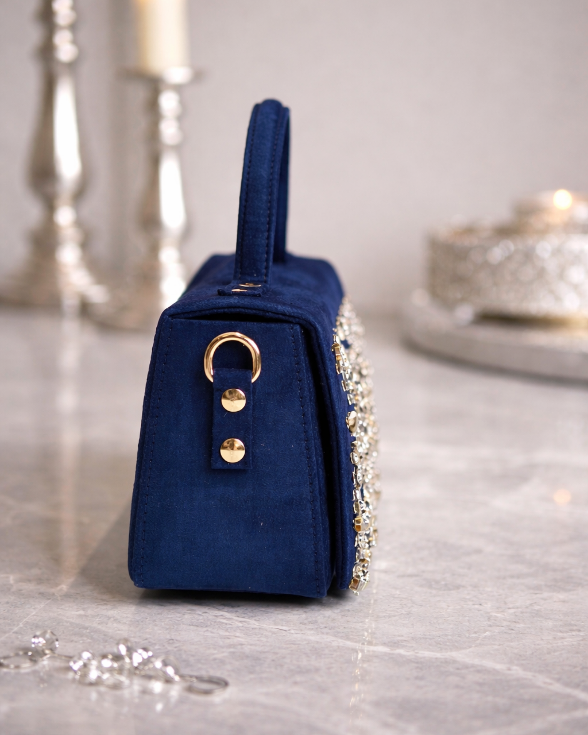 Estrella midnight navy butter suede satchel by House of Shine side view showing structured silhouette gold hardware and rhinestone embellished flap edge