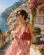 Woman wearing The Amarena embroidered shoulder bag while exploring Positano, Italy