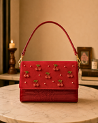 The Amarena hand embroidered bag India craftsmanship, studio product shot with cherry beading detail