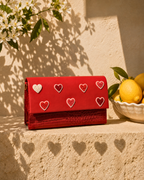 Amore structured red mini bag with hand-beaded heart motifs and croc-textured leather detailing