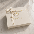 House of Shine signature gift box for the Bijou in Moonlit, cream box with gold foil branding, satin lining and branded ribbon, luxury handcrafted packaging, Bijou Edit.