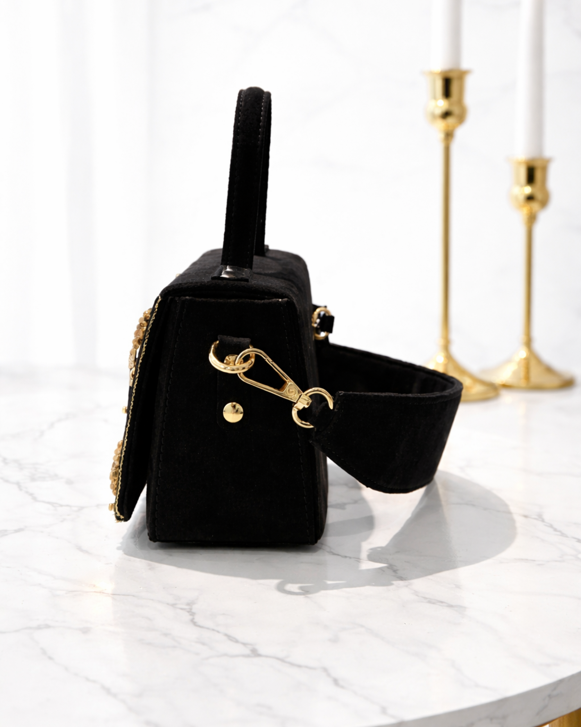 Side profile of Nocturne Satchel showing structured silhouette, gold hardware and detachable wide shoulder strap, Noir Atelier by The House of Shine