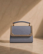 Close-up video of Something Blue crystal-embellished mini bag by House of Shine, camera zooming in and out to show hand-set crystal trim, saffiano texture, and gold-polished hardware, Bijou Edit.