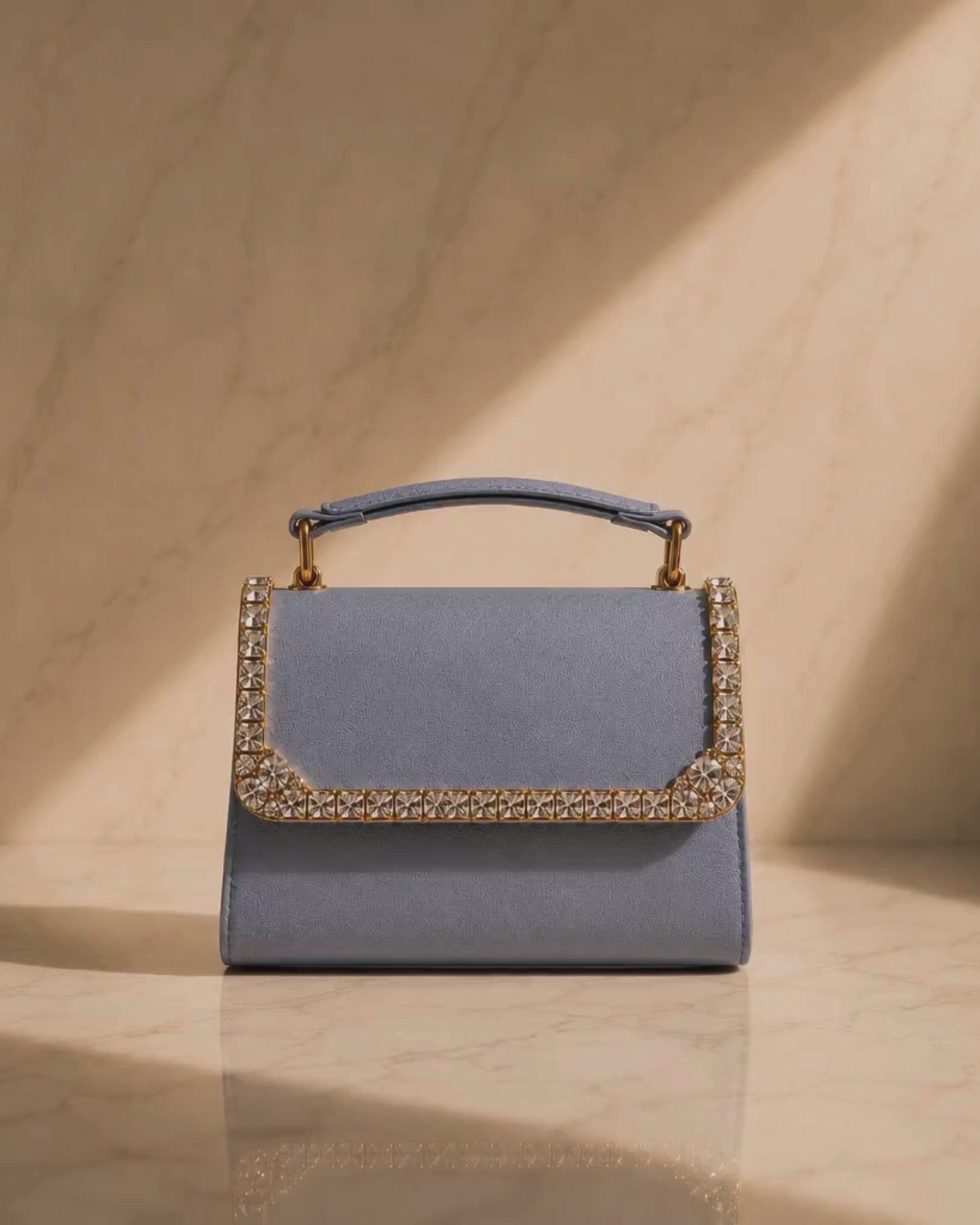 Close-up video of Something Blue crystal-embellished mini bag by House of Shine, camera zooming in and out to show hand-set crystal trim, saffiano texture, and gold-polished hardware, Bijou Edit.