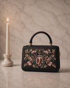 The House of Shine Florence hand-embroidered satchel — close-up detail of pomegranate floral motif in silk thread, pearl beads and gold embellishment