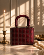 Valentina Mini Tote styled with brass candlestick and pearl dish on marble, Noir Atelier by The House of Shine